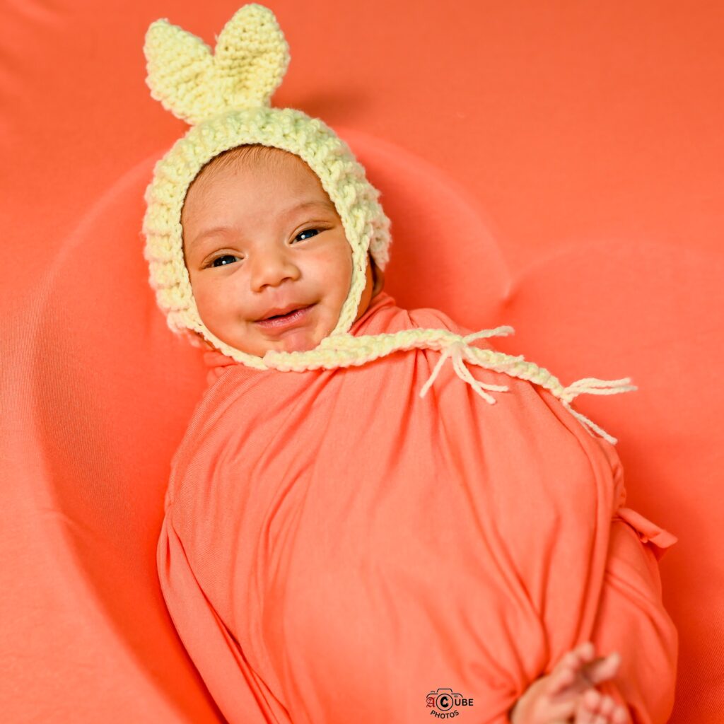 Newborn Smiling With Cap