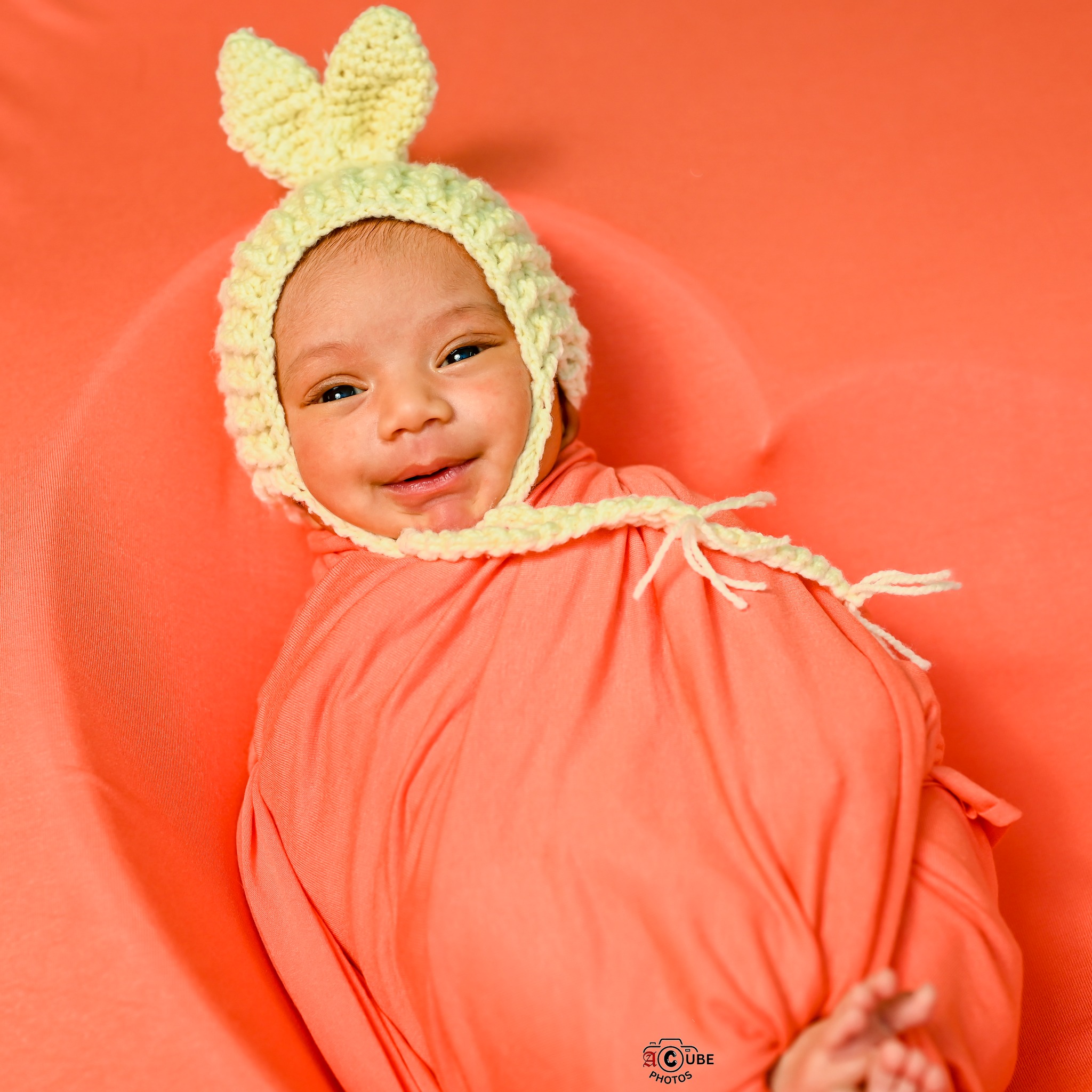 Newborn Smiling With Cap