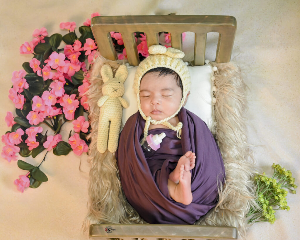 Newborn Girl in Bed