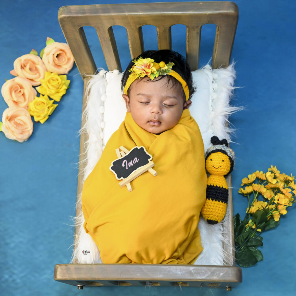 Newborn Baby Girl With Honey Bee