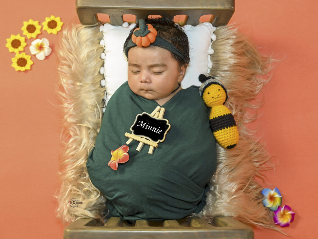 Newborn in Bed with Props