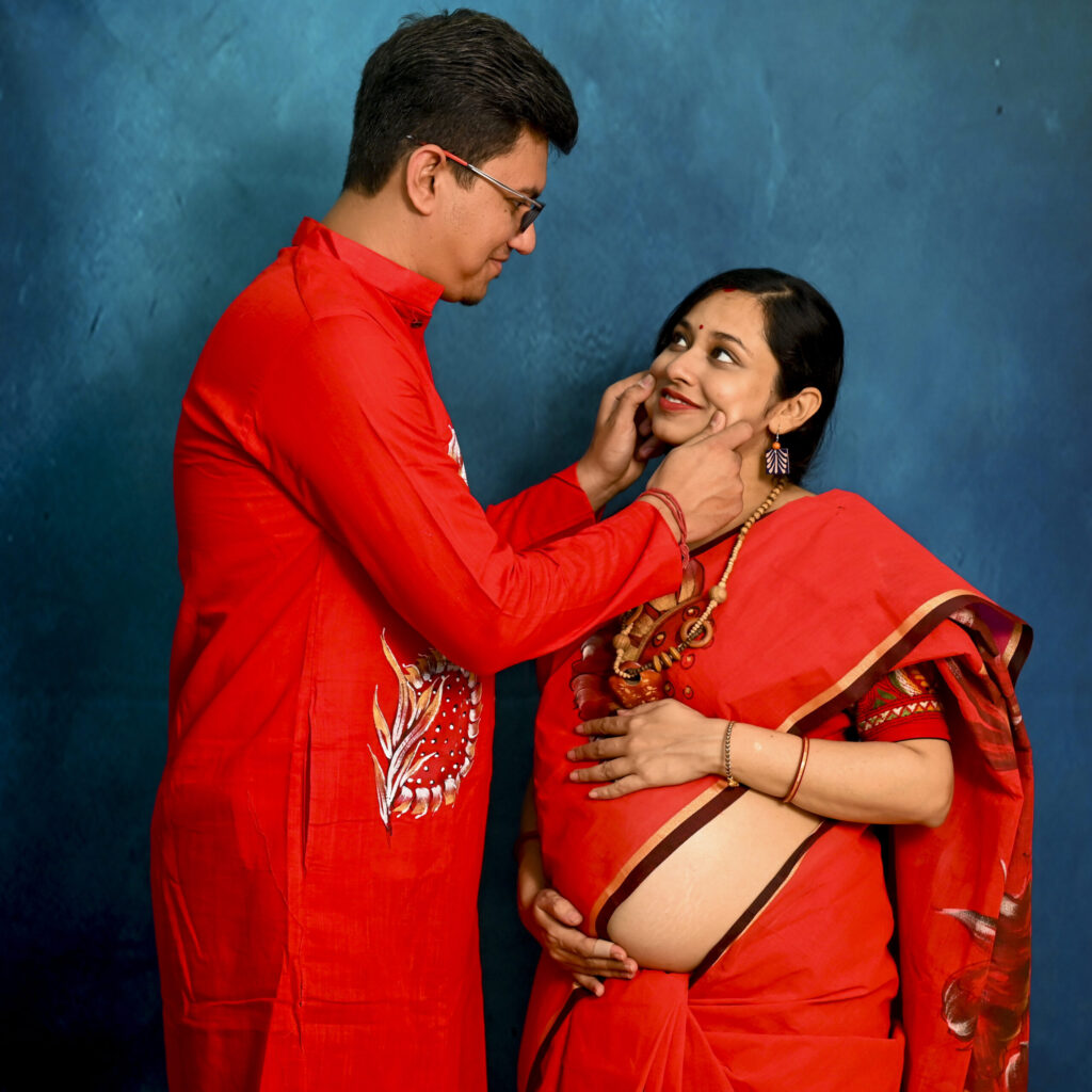 Indoor couple pose cute maternity