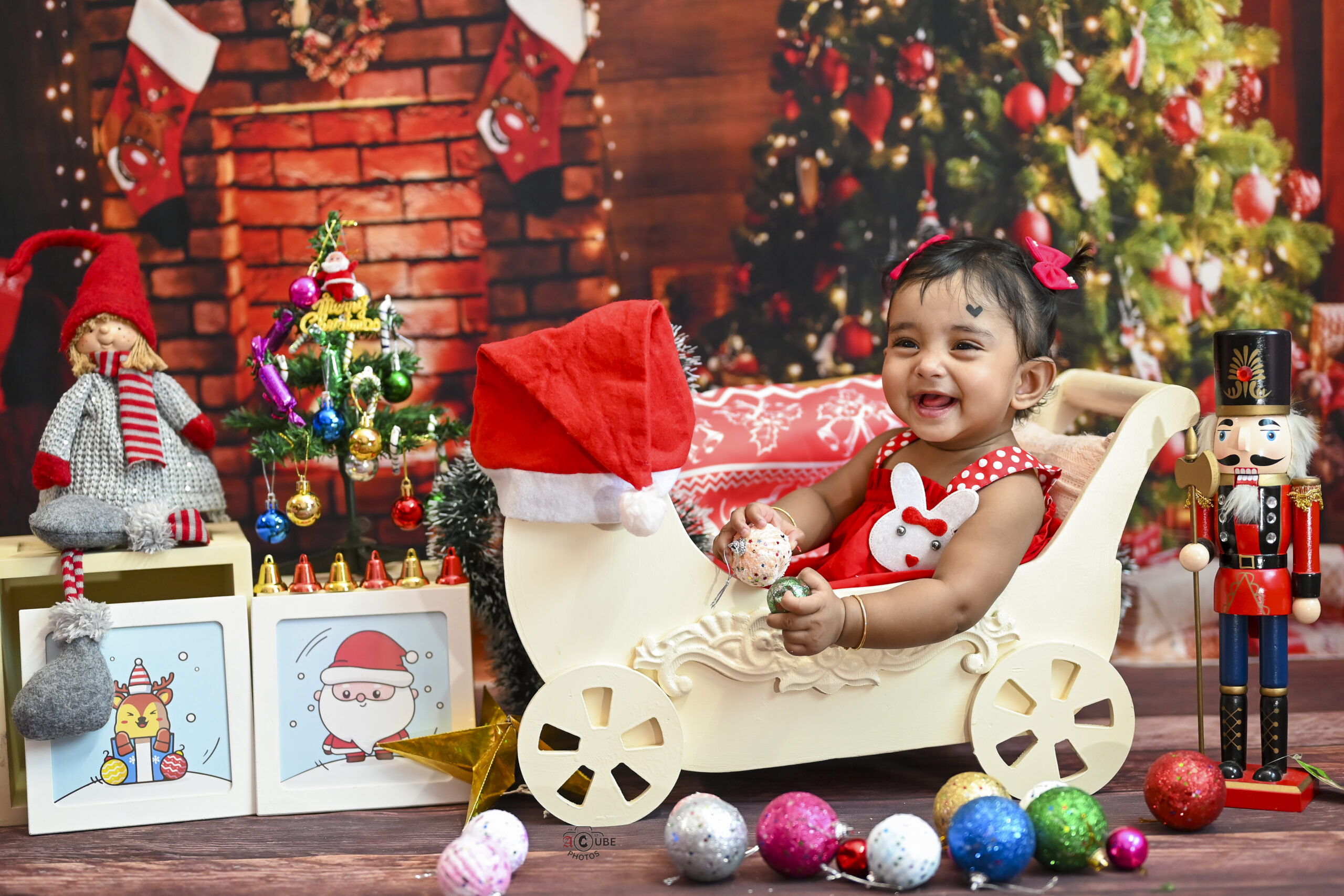 cozy christmas baby girl in sledge