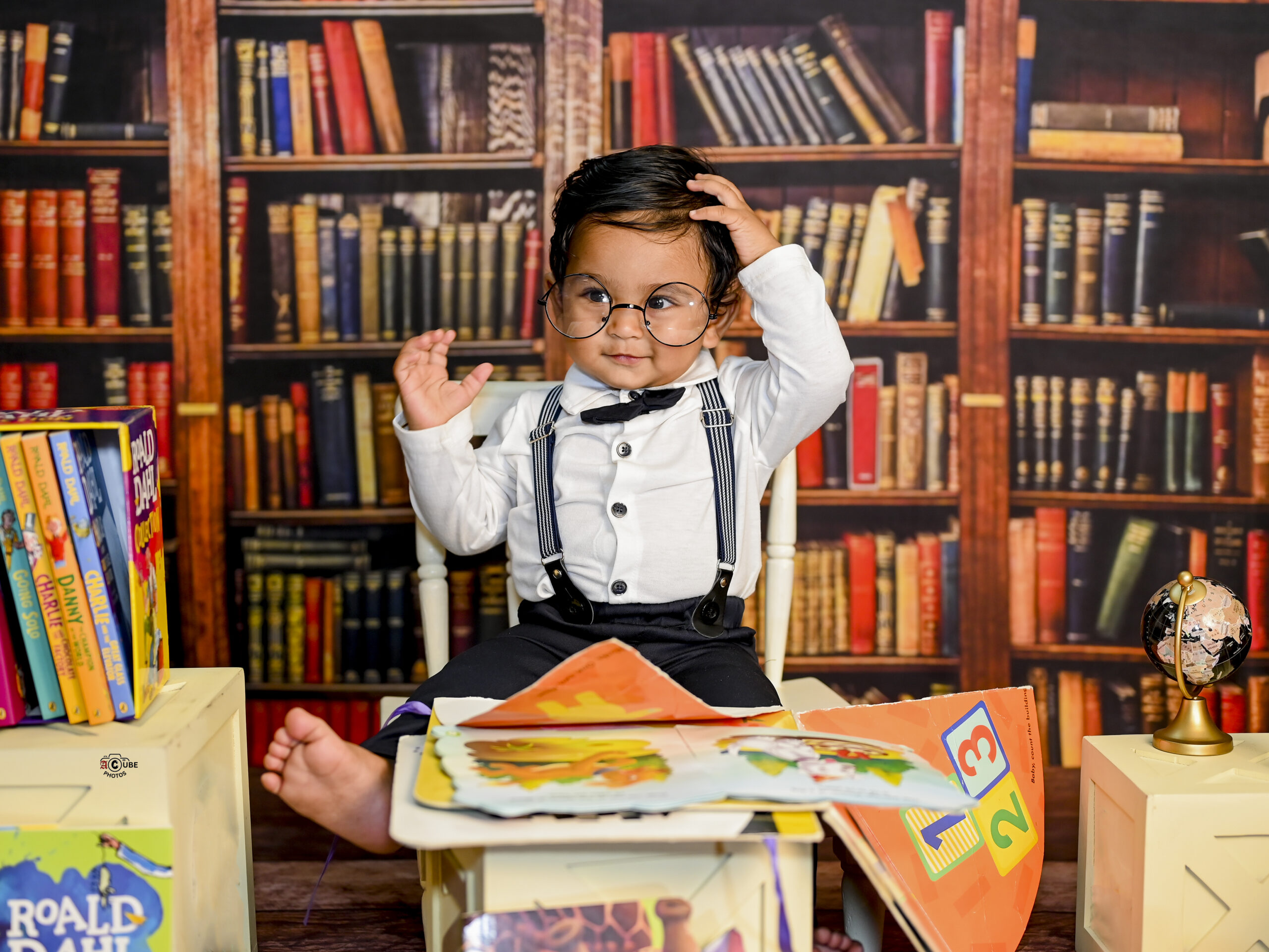 bookworm baby boy unique pose